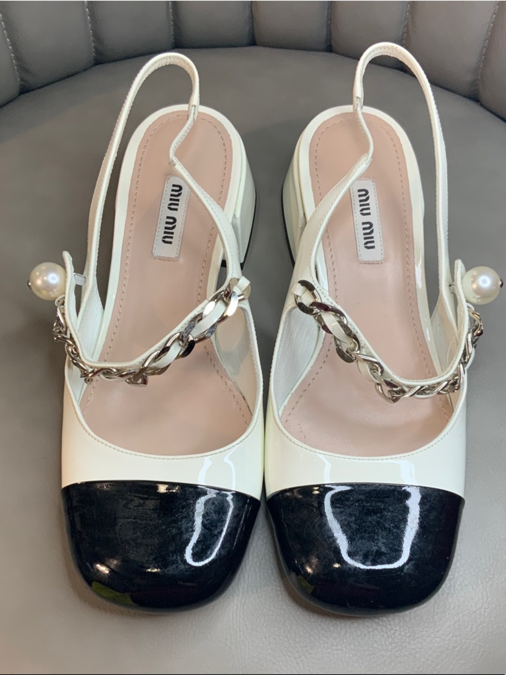 Miu Miu White Patent Slingback Pumps with Black Cap Toe and Pearl Chain